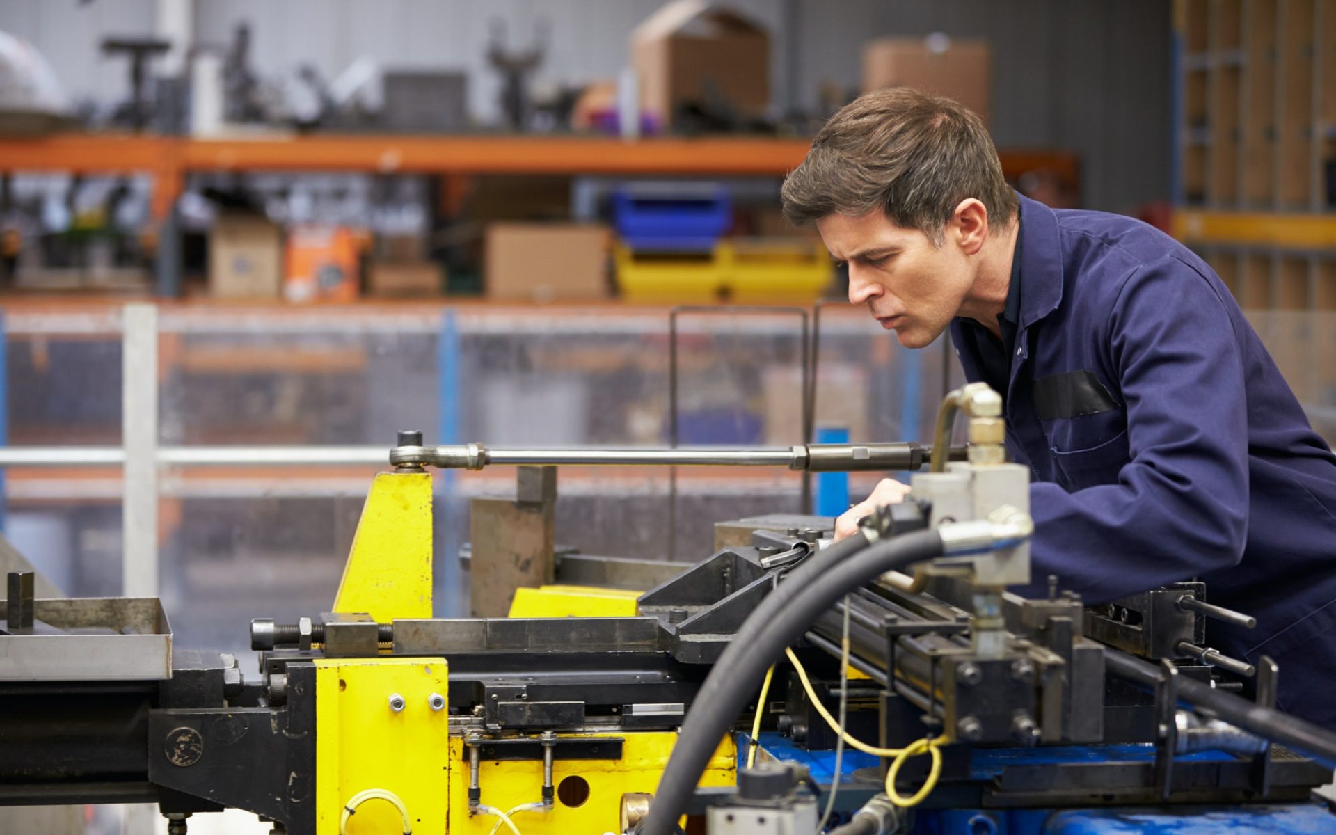 Factory Engineer Operating Hydraulic Tube Bender